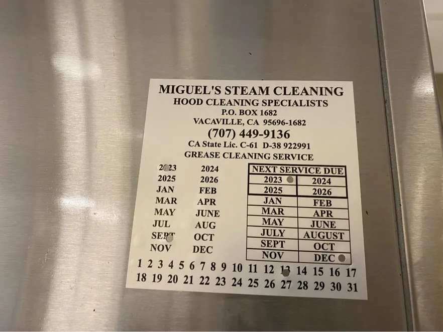Miguel's Steam Cleaning hood service label showing the next service due date